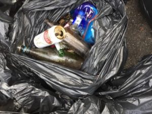 Rubbish bag filled with cans and bottles